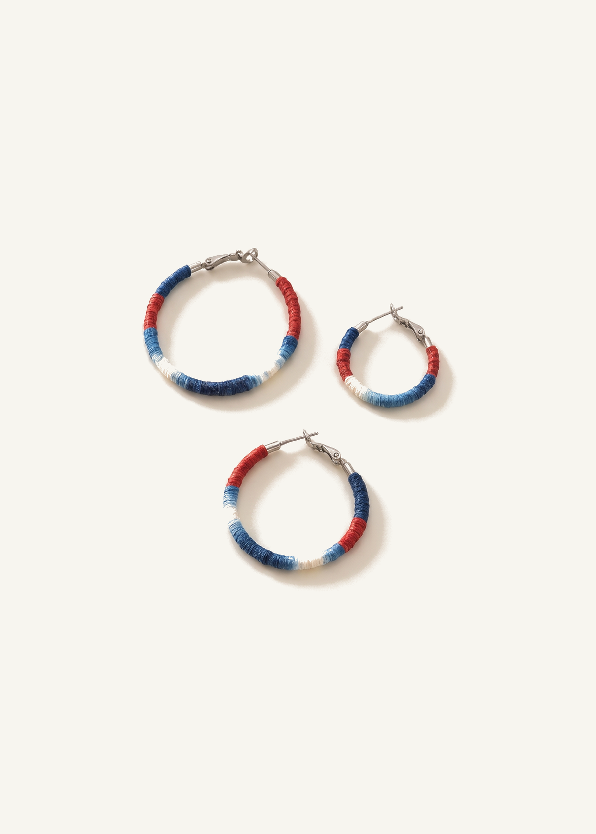 Shibori Textile Hoop Earrings — off-white background hero