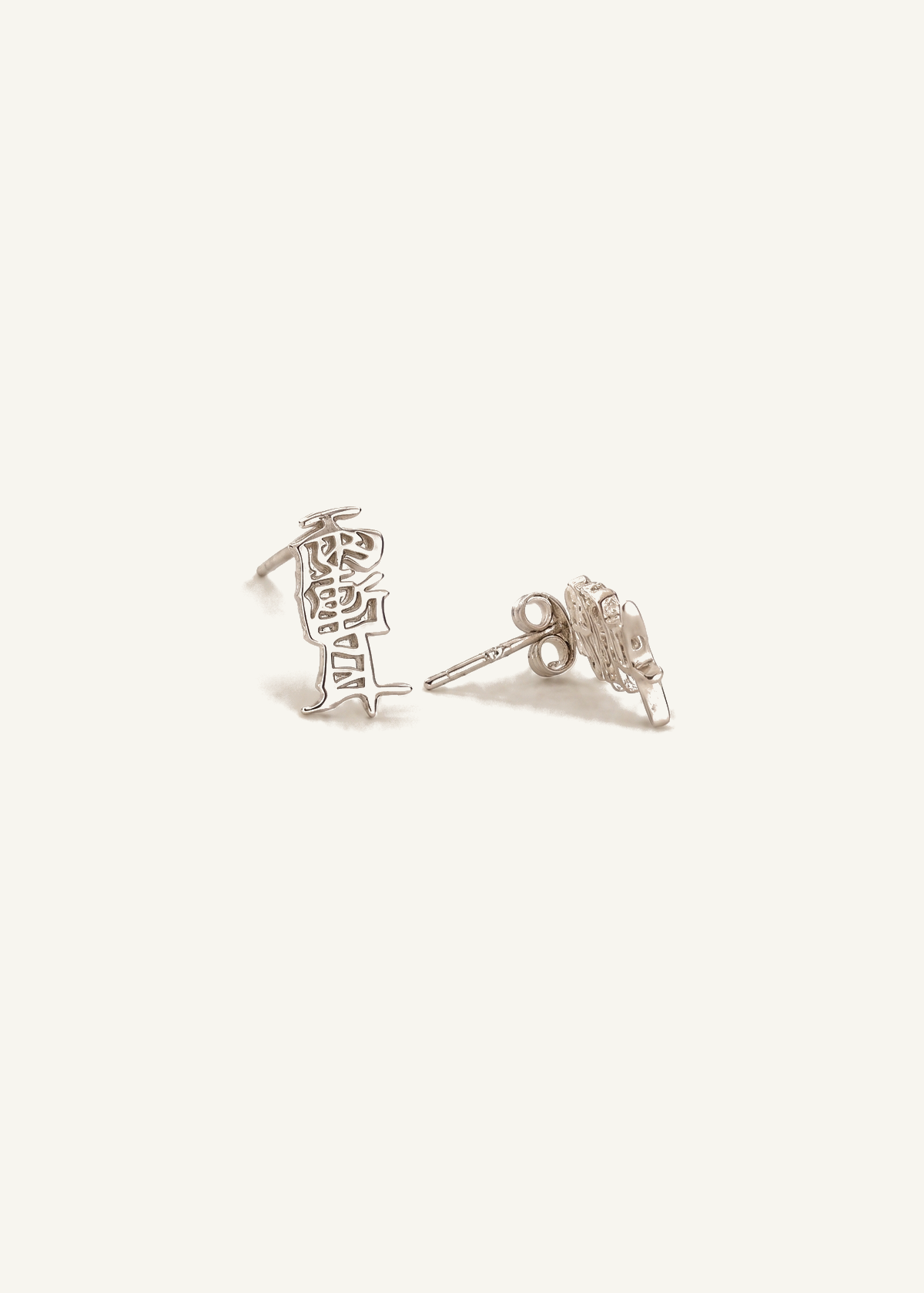 Taoist Amulet Stud Earrings — off-white background hero