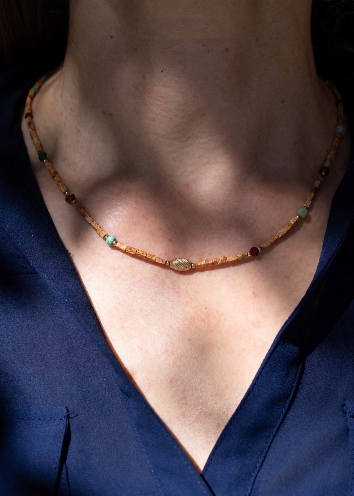 Landscape jasper choker worn with a navy V-neck top
