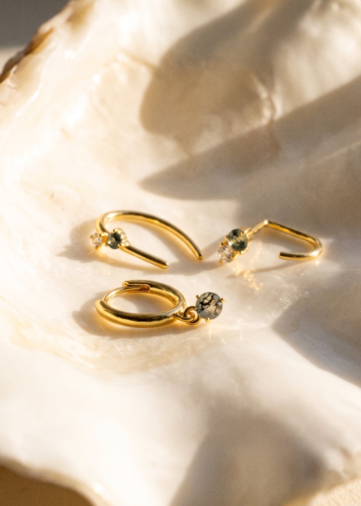 Gold Monet-inspired open and horseshoe hoops with moss agate accents