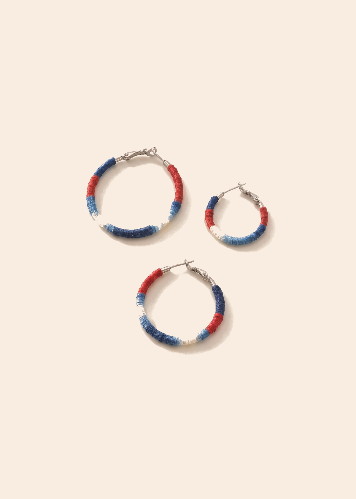 Shibori Textile Hoop Earrings — off-white background hero