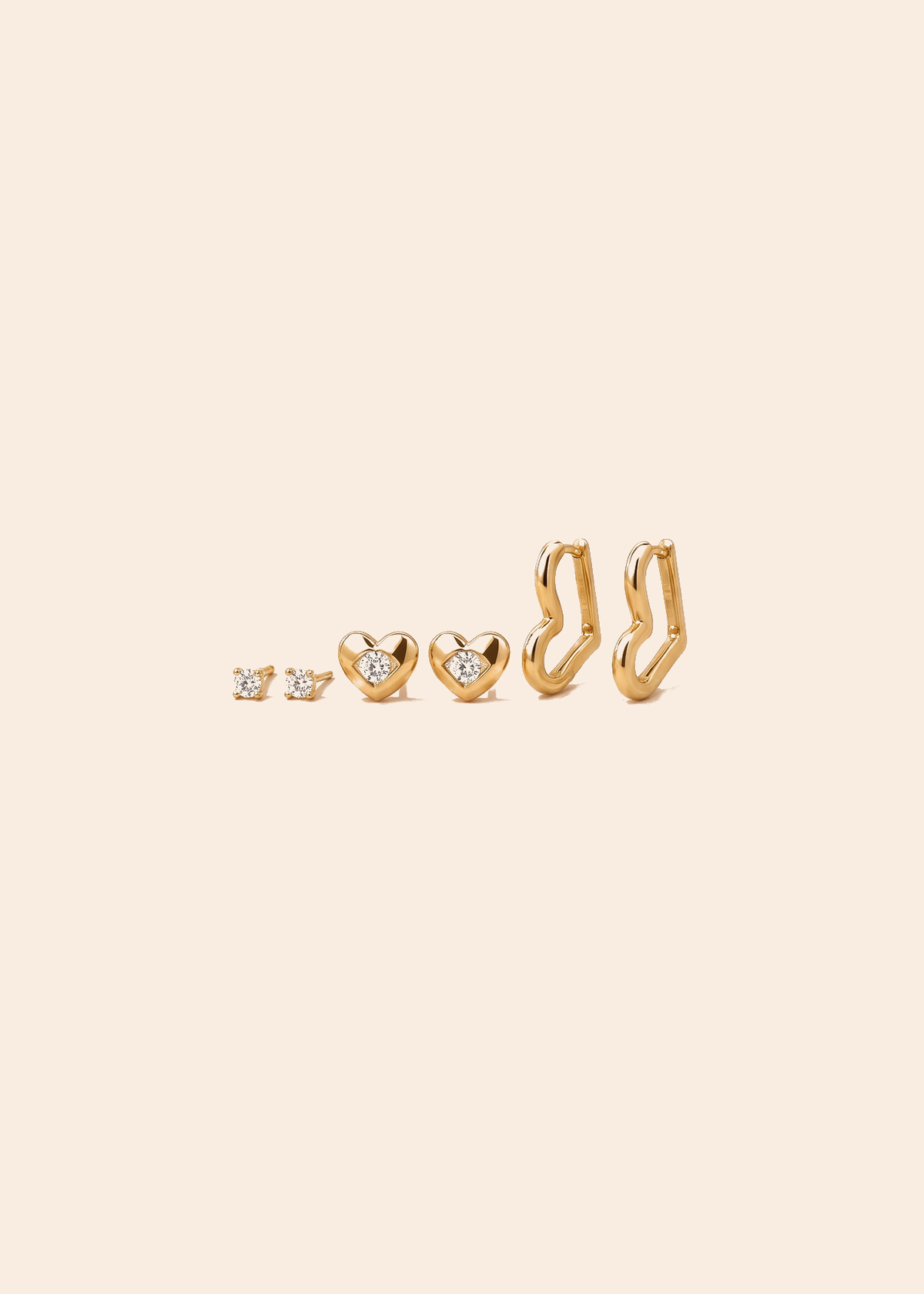 Gold Heart Earring Set with Huggie Hoop & CZ Heart Studs — off-white background hero