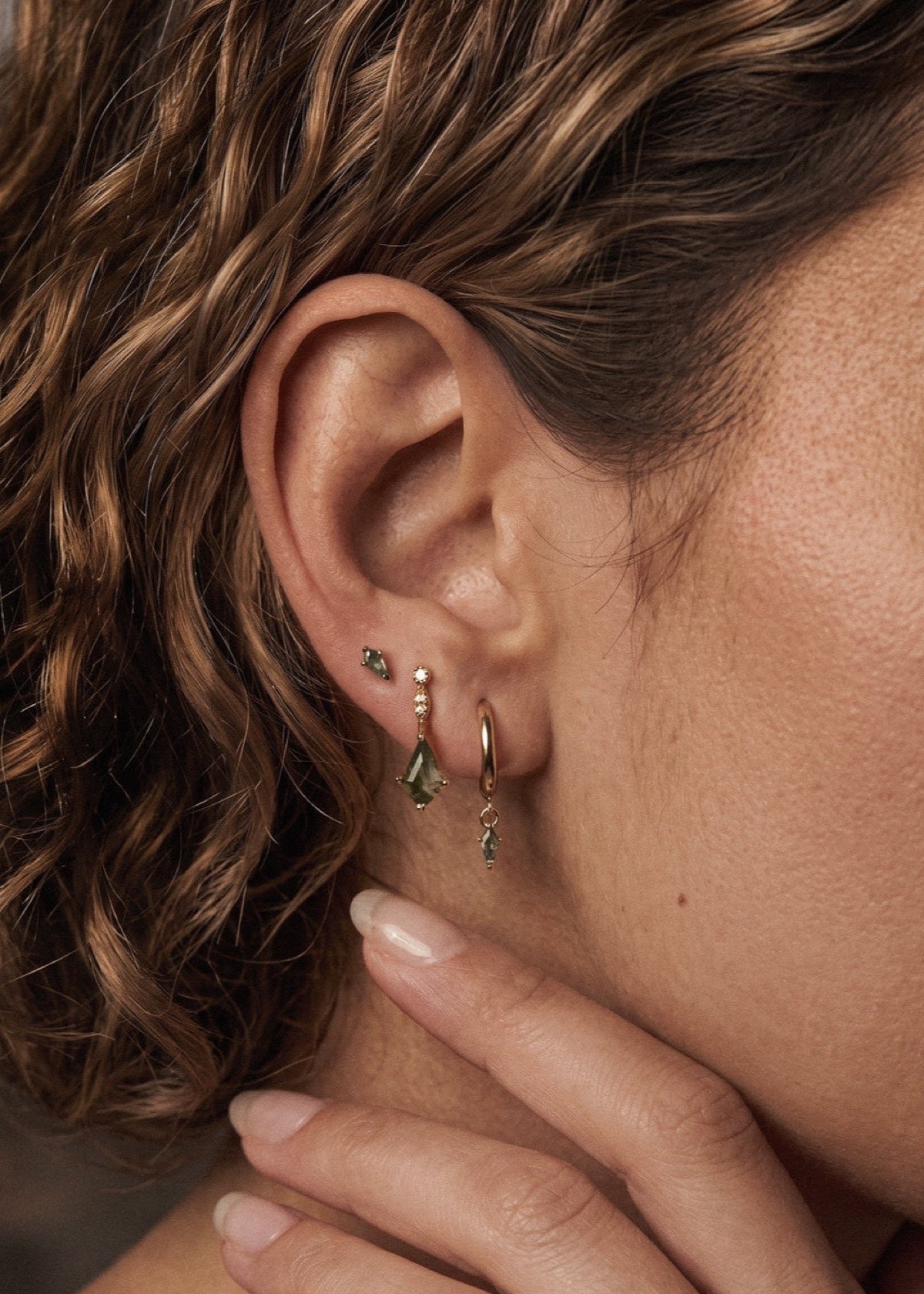 Gold moss agate kite studs and hoops worn as an ear stack